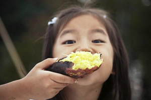 Child eating sweet potato